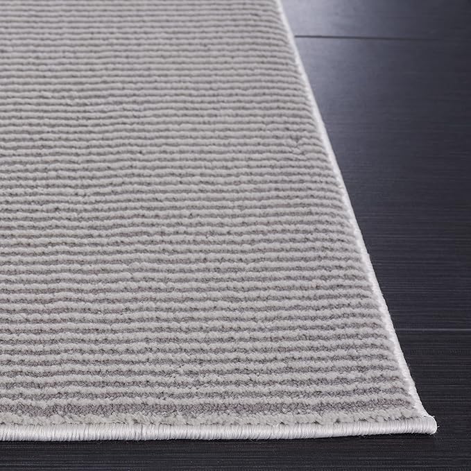 SAFAVIEH Revive Collection Area Rug - 6'7" x 9', Grey, Solid Design, Non-Shedding & Easy Care, Ideal for High Traffic Areas in Living Room, Bedroom, Dining (REV102F-6)