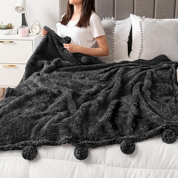 PAVILIA Black Sherpa Throw Blanket for Couch, Warm Plush Pom Pom Throw, Fuzzy Sofa Blanket, Lightweight Soft Cozy Fluffy With Pom Poms, 50x60