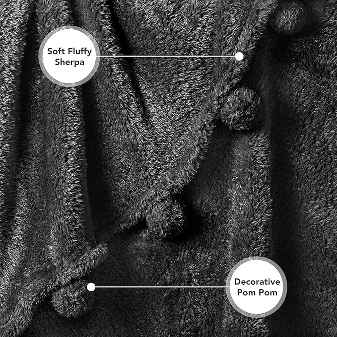 PAVILIA Black Sherpa Throw Blanket for Couch, Warm Plush Pom Pom Throw, Fuzzy Sofa Blanket, Lightweight Soft Cozy Fluffy With Pom Poms, 50x60