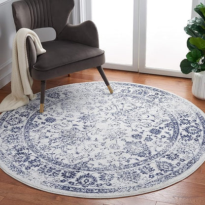 SAFAVIEH Adirondack Collection Area Rug - 6' Round, Ivory & Navy, Distressed Vintage Floral Design, Non-Shedding & Easy to Clean, Ideal for Living Room, Bedroom, Dining Space (ADR109M)